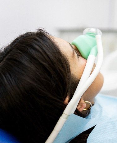 Woman relaxing while breathing in nitrous oxide