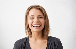 girl in black shirt smiling