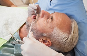 Older man getting a dental exam