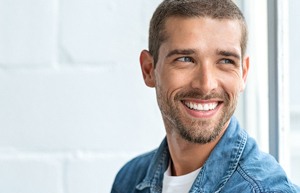 Man smiling looking to the window