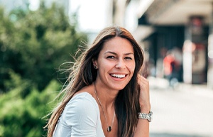 Woman smiling outside