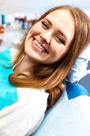 Woman smiling after her root canal treatment in Bullard