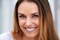 Close-up of woman with long hair smiling