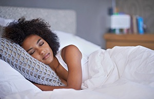 Woman sleeping soundly in bed