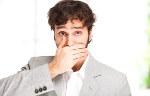 man covering mouth