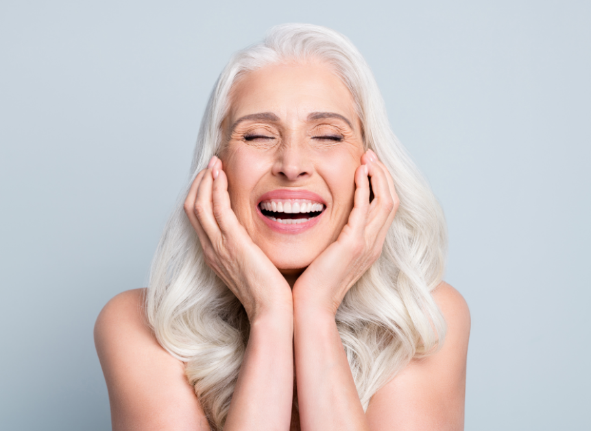 Woman smiling with dental implants