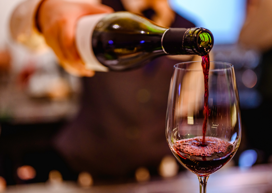 Red wine being poured in glass