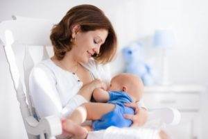 a woman breastfeeding her child