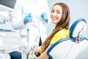 Woman smiling in dental chair at dentist in Bullard